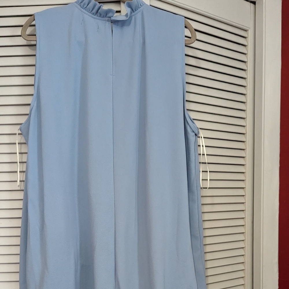 Lane Bryant Light blue blouse size 4x. High/ low style with ruffled neck line.